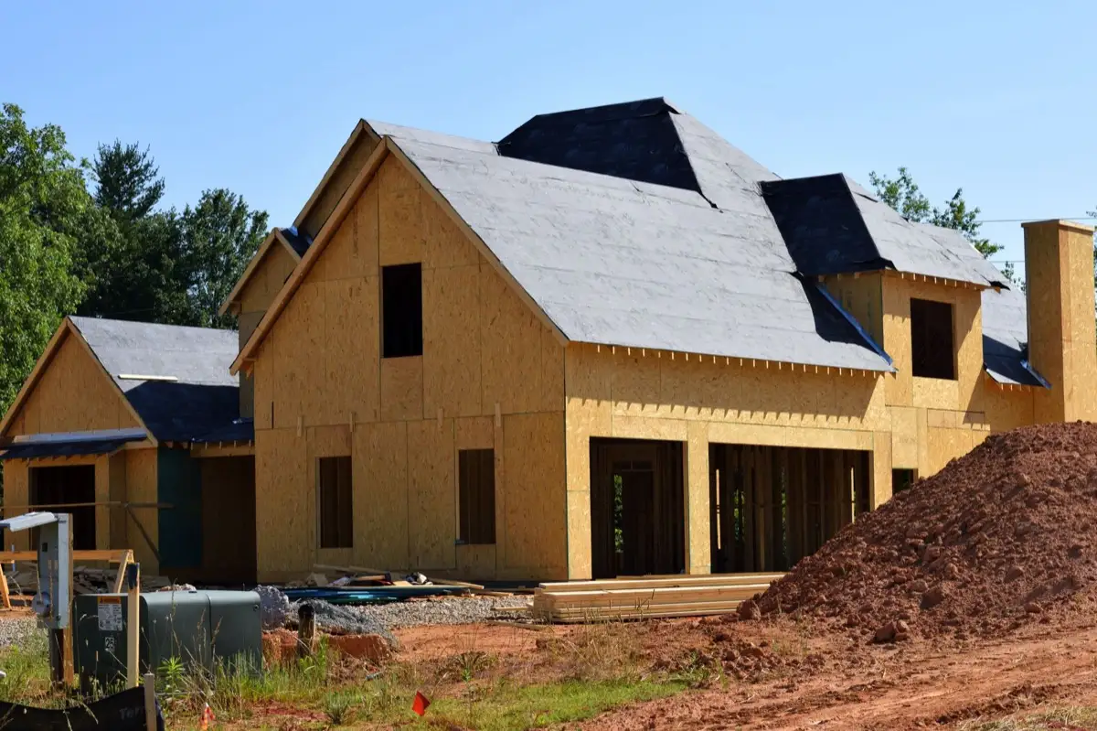 House with new roof decking and synthetic underlayment during a roof replacement in Edmond, OK