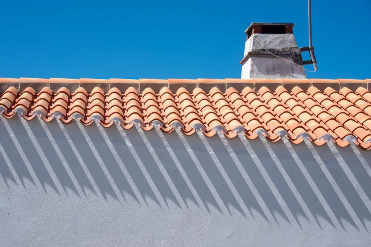 Roof ridge line and chimney on a home in Edmond, OK